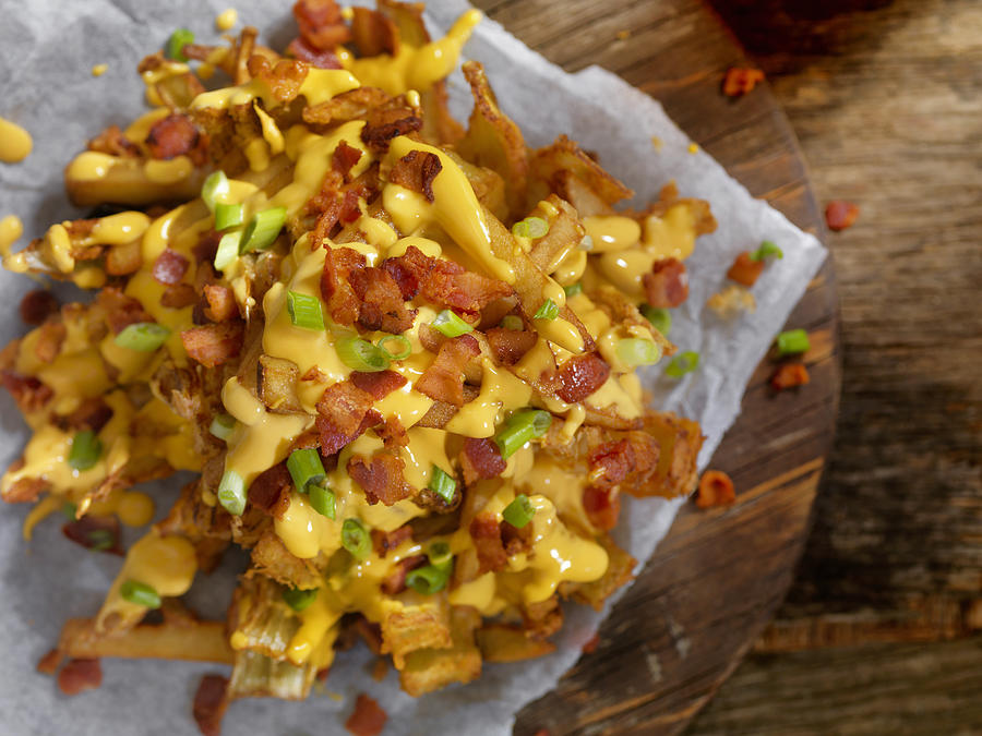 Loaded Blooming Onion with Fries, Cheese Sauce and Bacon #1 Photograph by LauriPatterson