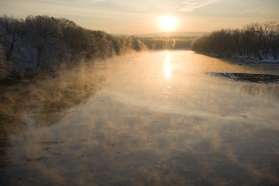 Looking down the Connecticut River in Montague, Massachusetts at sunrise on a frosty, single digit degree fahrenheit morning #1 Photograph by John Nordell