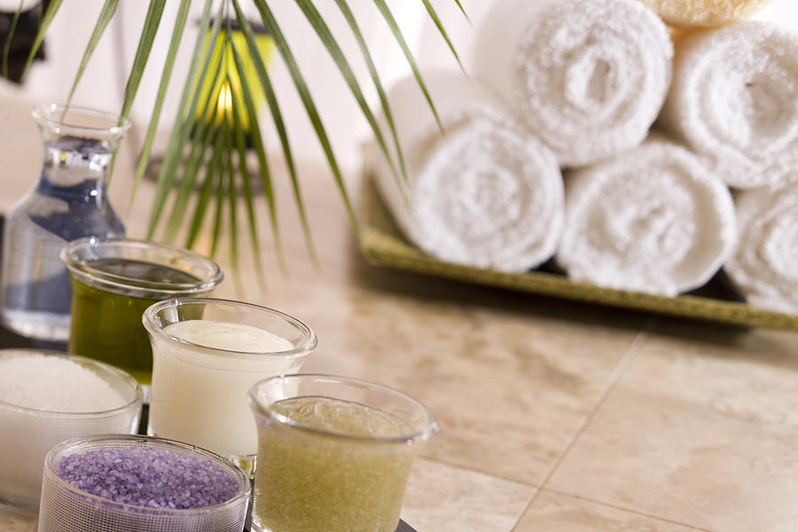 Lotions, candle, and towels #1 Photograph by Comstock Images