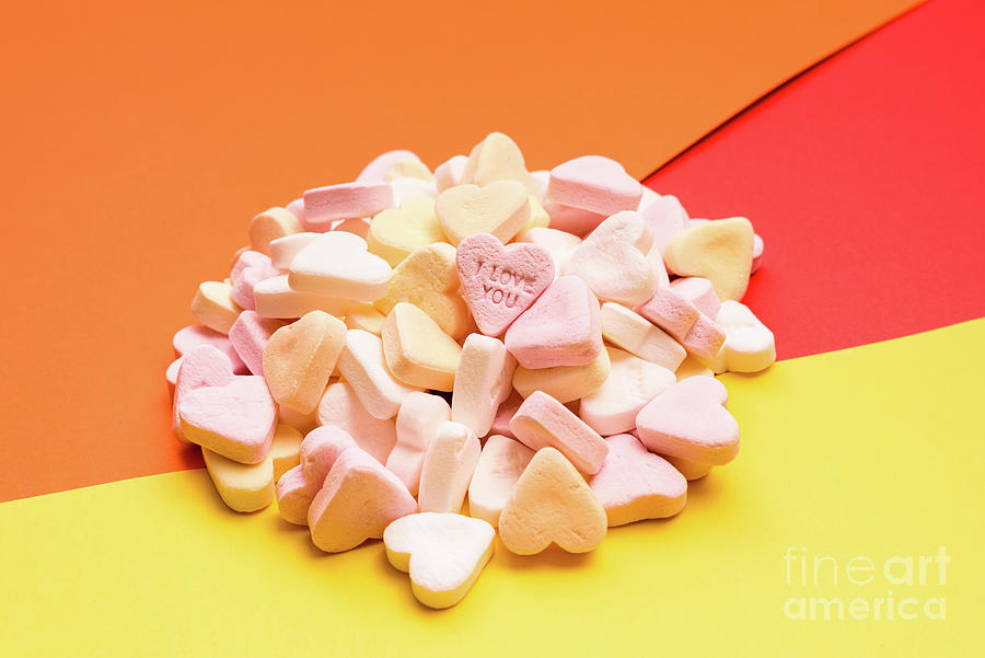 Love word engraved in a sweet romantic heart-shaped candy to giv #1 Photograph by Joaquin Corbalan