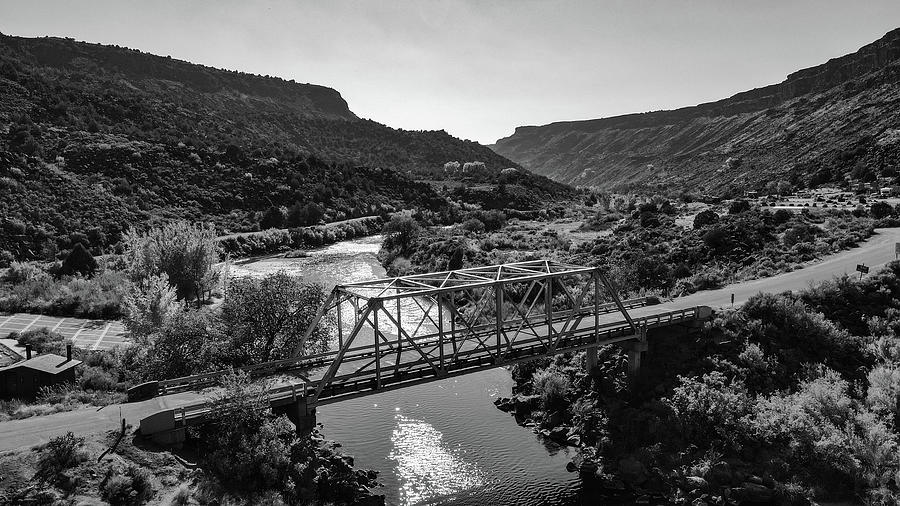 Low road to Taos New Mexico with bridge in black and white #1 Photograph by Eldon McGraw