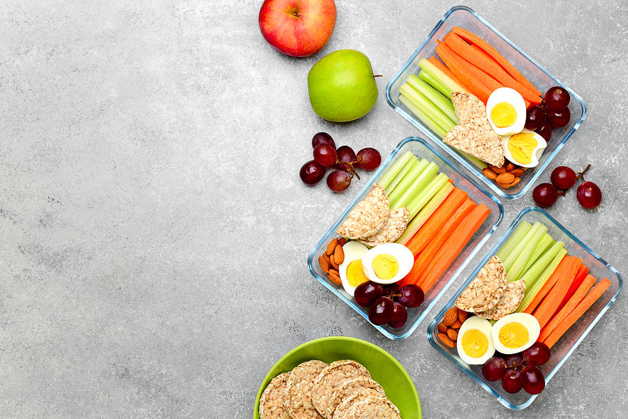 Lunch boxes with healthy snacks, overhead view #1 Photograph by Fortyforks