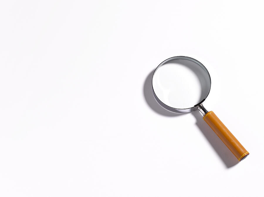 Magnifier on white background with copy space. #1 Photograph by Peter Dazeley