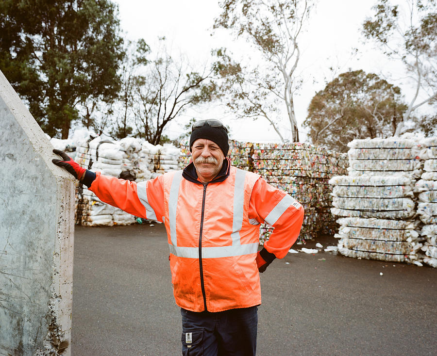 Man at recycling centre #1 Photograph by Michael Hall