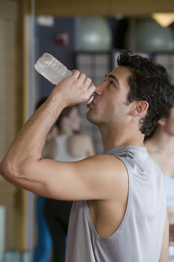Man drinking bottled water #1 Photograph by Comstock Images