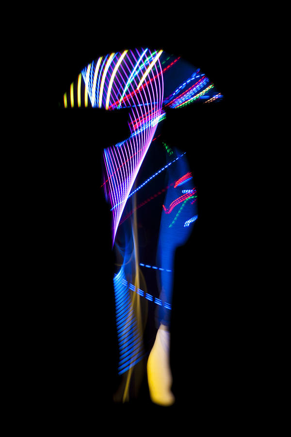 Man holding an umbrella with light trail texture #1 Photograph by Colormos