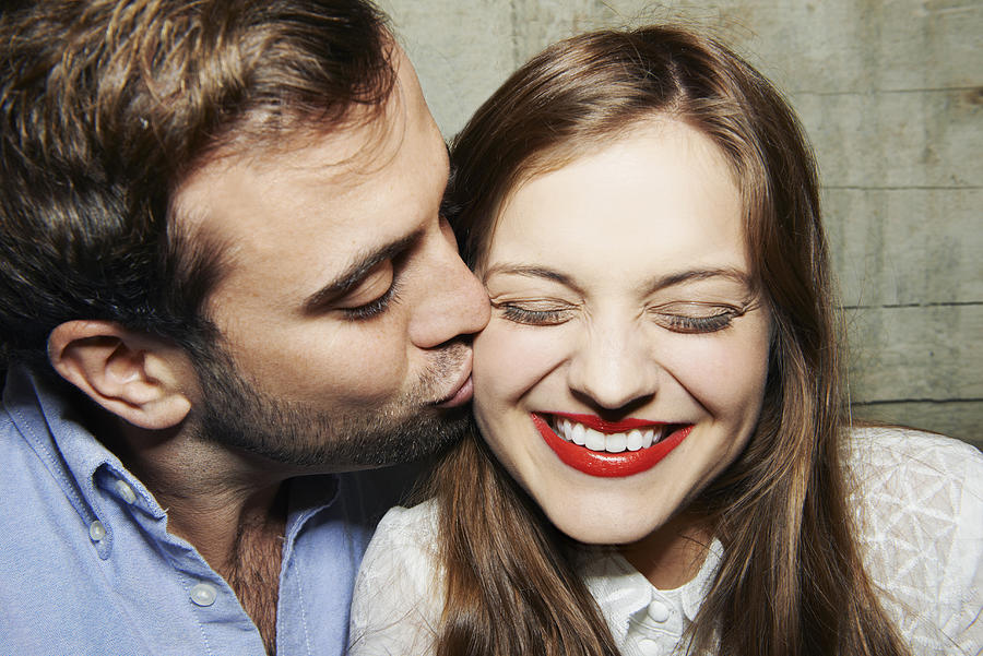 Man Kissing Woman On Cheek #1 Photograph by Tara Moore