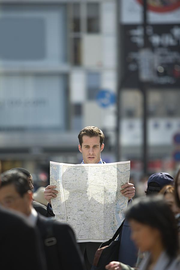Man reading map #1 Photograph by Image Source