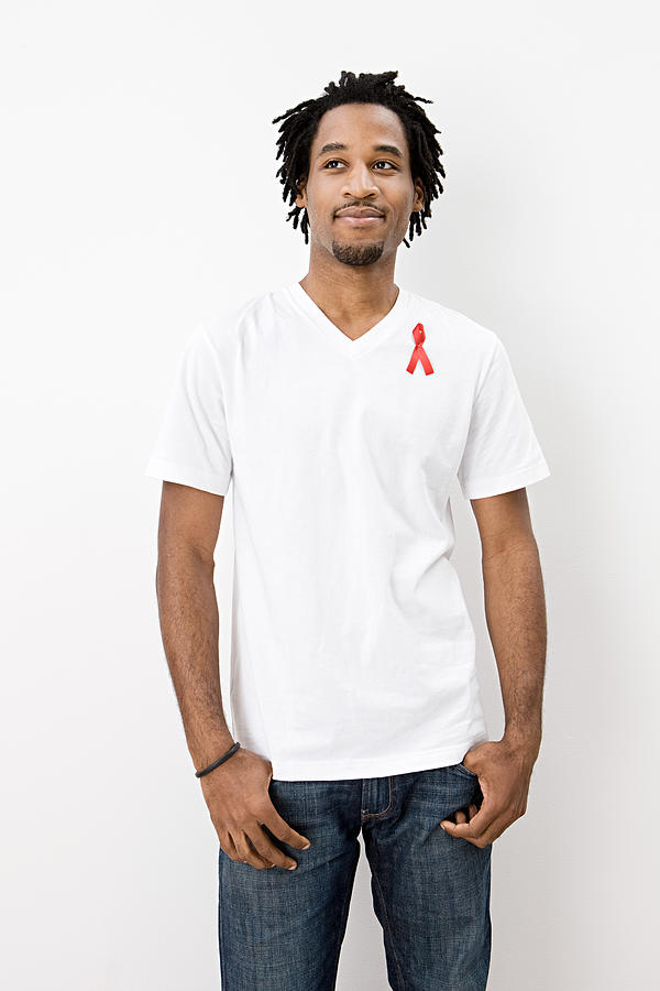 Man wearing aids awareness ribbon #1 Photograph by Image Source
