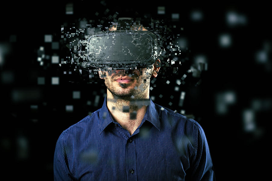 Man wearing virtual reality headset #1 Photograph by Nastasic
