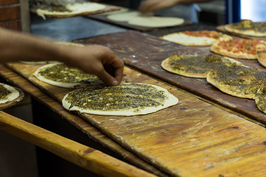Manouche, Lebanese flatbread, with Zaatar prepared in bakery, Beirut, Lebanon #1 Photograph by Malcolm P Chapman