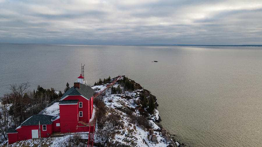 Marquette Harbor Lighthouse along Lake Superior in Marquette Michigan in the winter #1 Photograph by Eldon McGraw