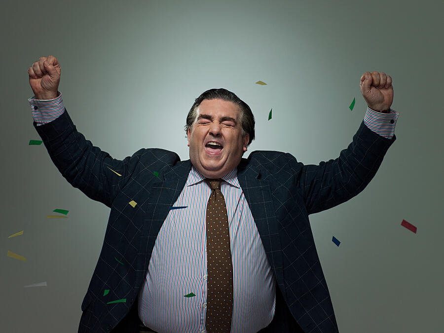 Mature businessman with ticker tape, portrait #1 Photograph by Image Source