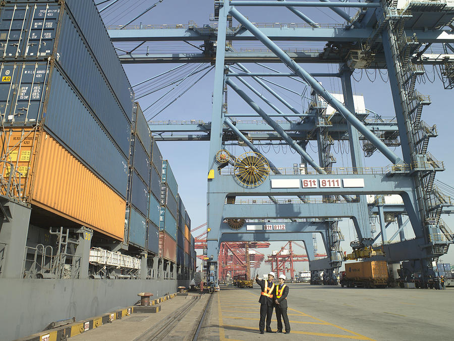 Men at container terminal #1 Photograph by Image Source