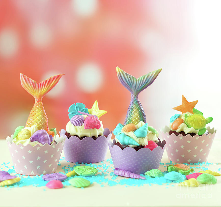 Mermaid theme cupcakes with colorful glitter tails, shells and sea creatures. #1 Photograph by Milleflore Images