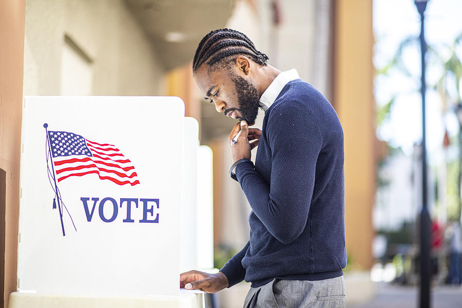 Millenial Black Man Voting in Election #1 Photograph by Adamkaz
