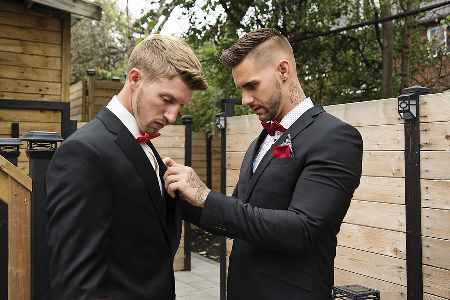 Millenial men getting ready for wedding. #1 Photograph by Martinedoucet