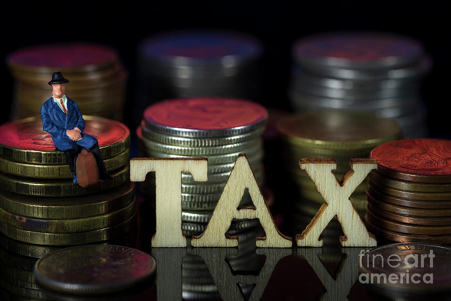 Miniature People. Man sitting on coin stacks with Text. IRPF Taxman Concept. Macro #1 Photograph by Pablo Avanzini
