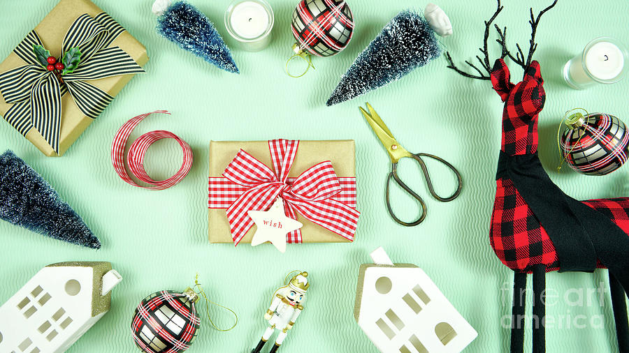Modern Christmas gifts with buffalo plaid reindeer and decorations. #1 Photograph by Milleflore Images