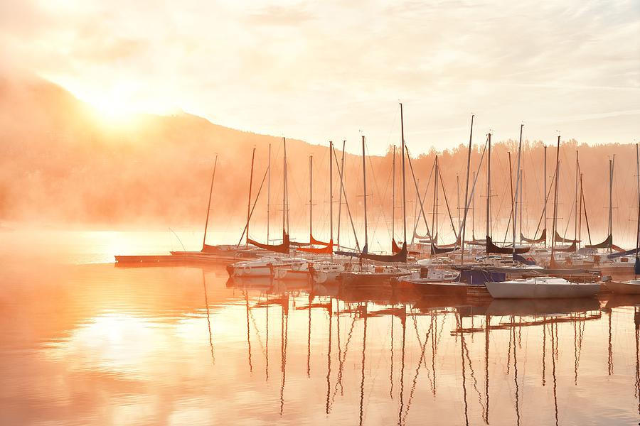Morning foggy lake boat sunrise #1 Photograph by Songquan Deng