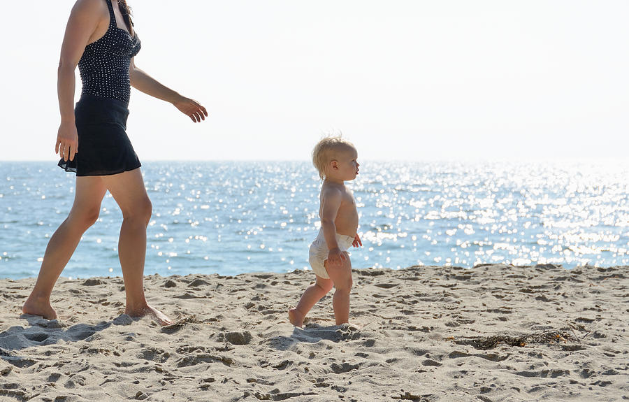 Mother and toddler walking on beach #1 Photograph by Cultura RM Exclusive/JLPH