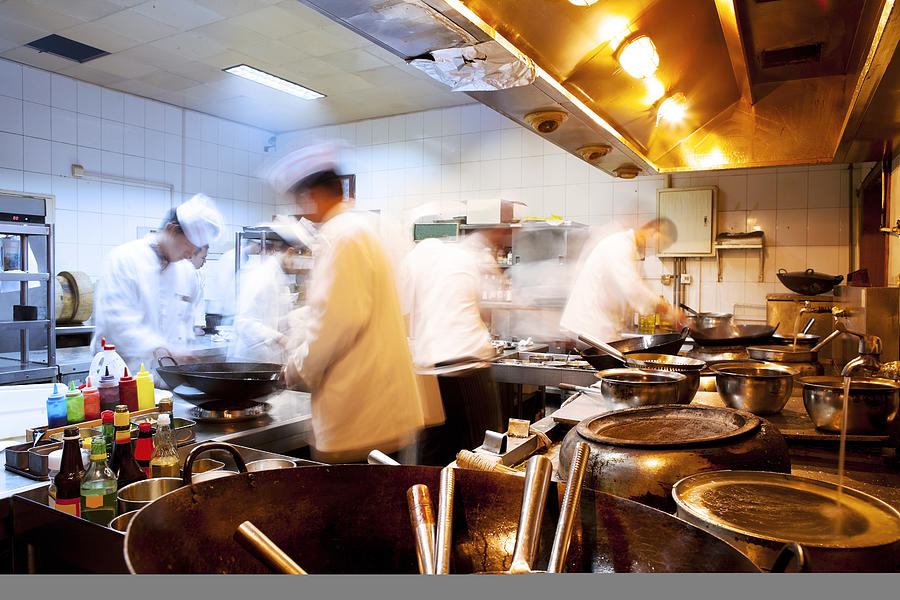 Motion Chefs Of A Restaurant Kitchen #1 Photograph by Beijingstory