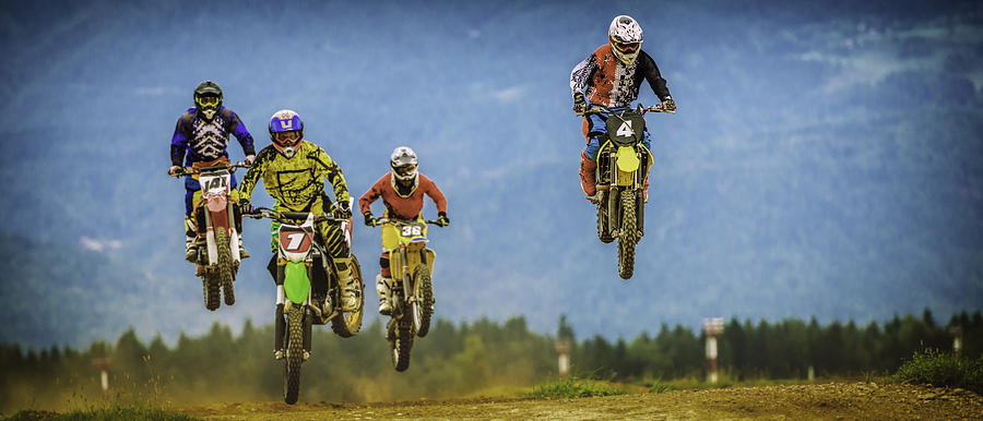 Motocross bikers in the air #1 Photograph by Vm