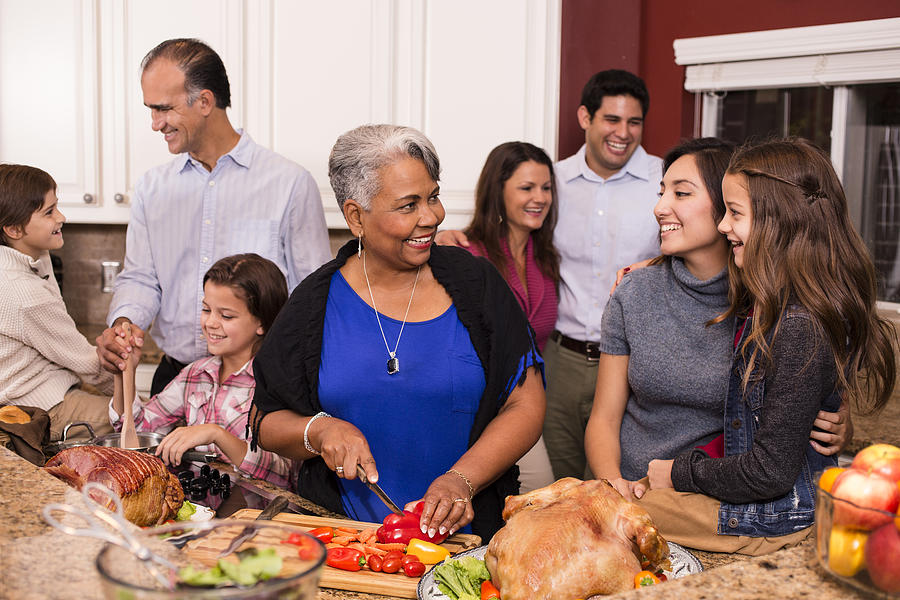 Multi-ethnic family cooks Thanksgiving, Christmas dinner in grandmothers home kitchen. #1 Photograph by Fstop123