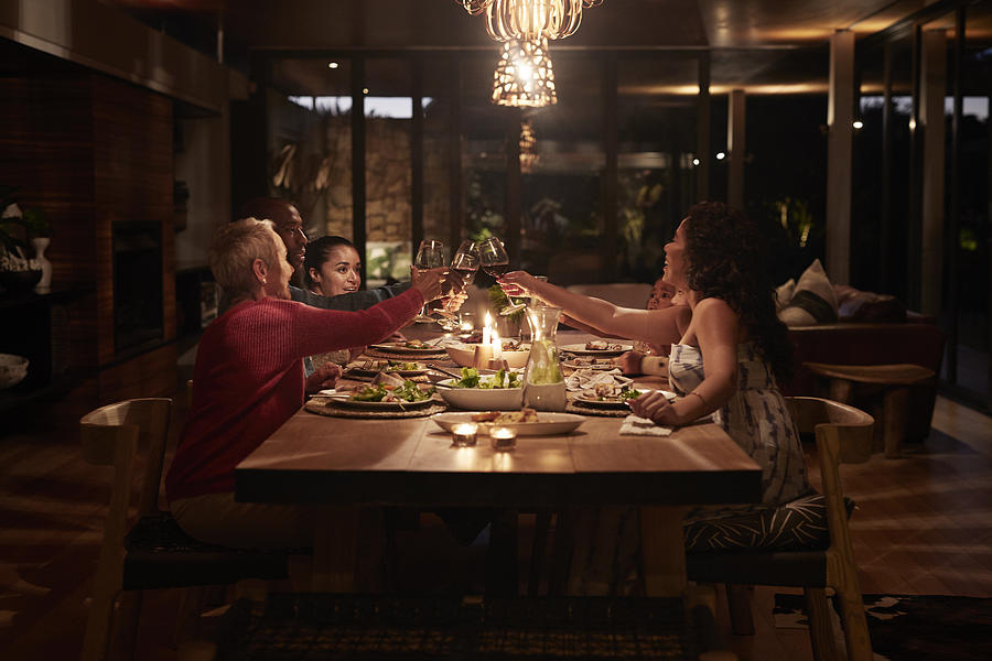Multigenerational family having dinner #1 Photograph by Klaus Vedfelt