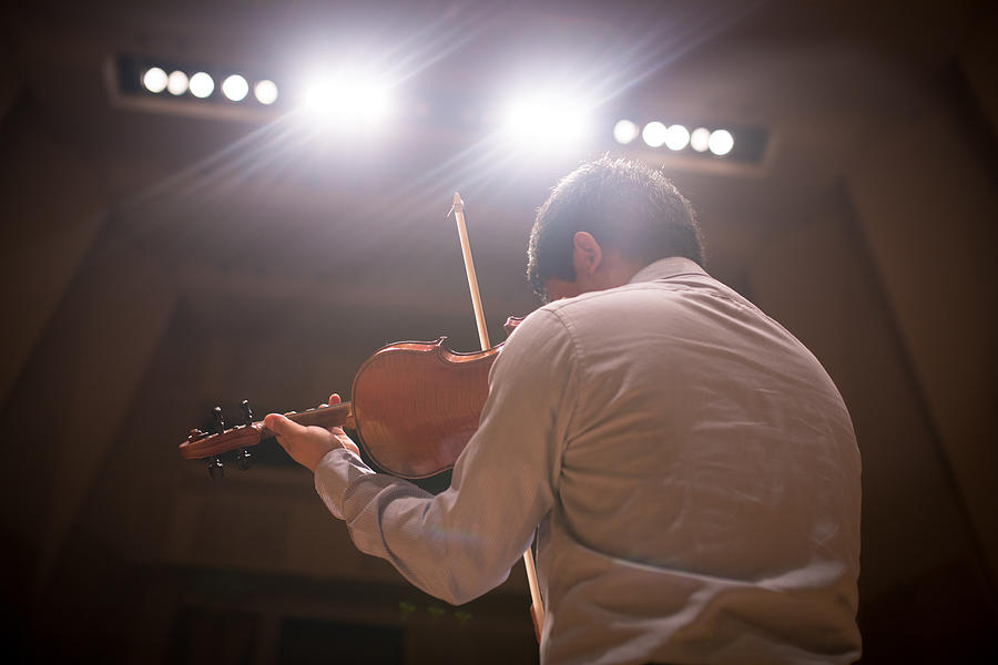 Musician playing violin on stage #1 Photograph by Satoshi-K