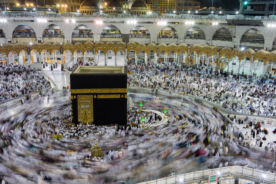 Muslim pilgrims circumambulate or tawaf the Kaabah #1 Photograph by Shaifulzamri