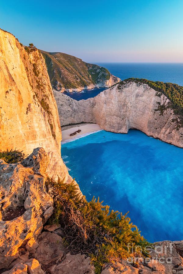 Navagio shipwreck beach in Zakynthos Greece at sunset #1 Photograph by Michal Bednarek