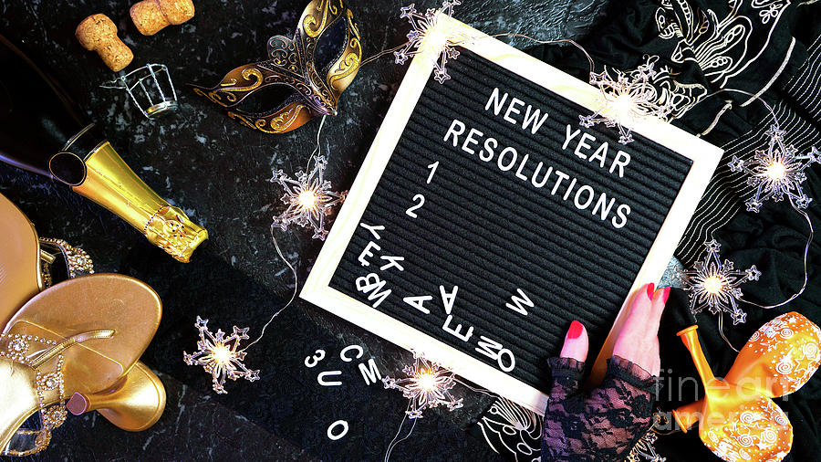 New Year's Eve resolutions letter board and black and gold party