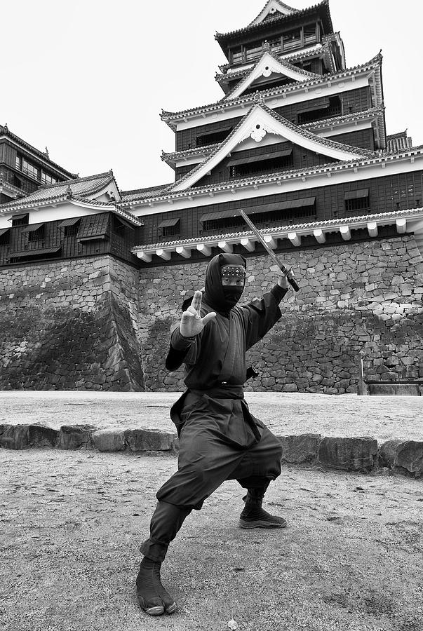Ninja warrior posing in front of famous Kumamoto Castle in Kyushu ...
