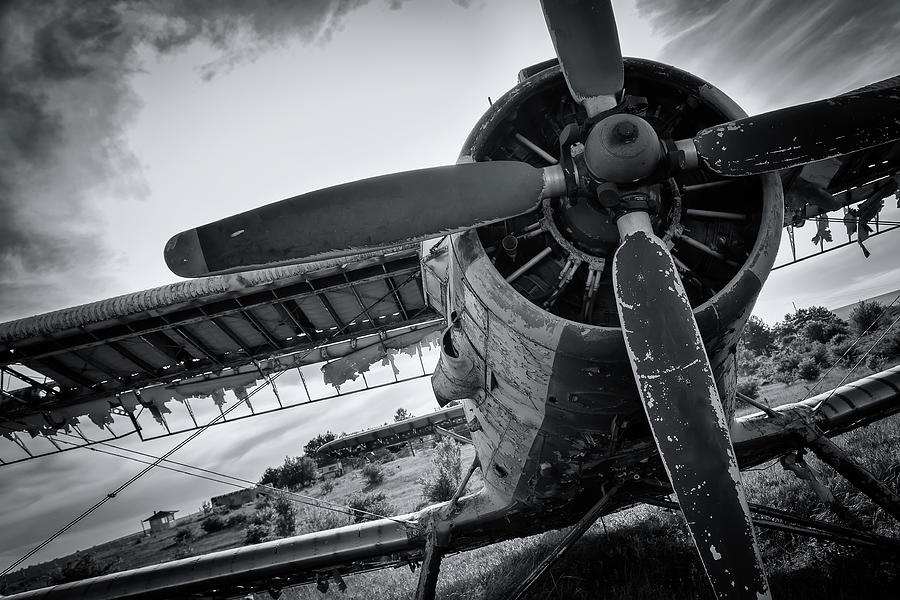 Old Airplane On Field In Black And White Photograph
