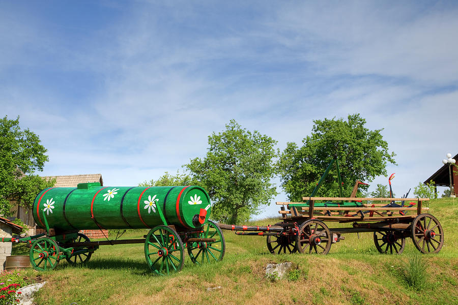 Old farm machinery in Nova Vas, Slovenia #1 Photograph by Ian Middleton