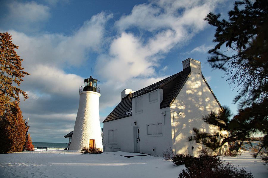 Old Presque Isle Lighthouse in Michigan along Lake Huron in the winter #1 Photograph by Eldon McGraw