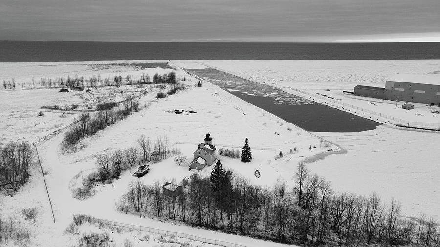 Ontonagon Michigan Lighthouse along Lake Superior in winter black and white #1 Photograph by Eldon McGraw