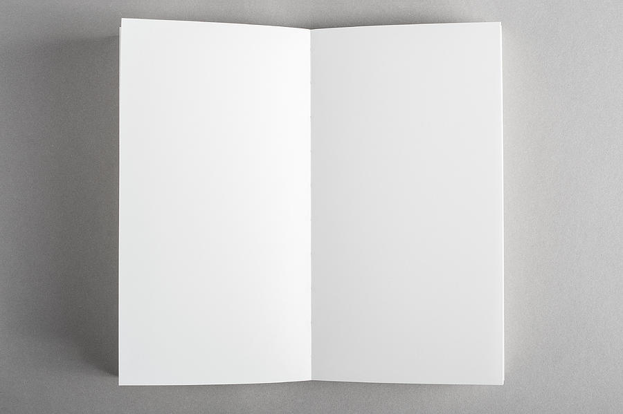 Opened blank magazine book on gray background #1 Photograph by Mensent Photography