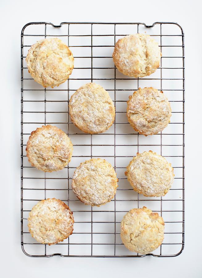 Overhead view of freshly baked scones on cooling rack #1 Photograph by Tim Macpherson