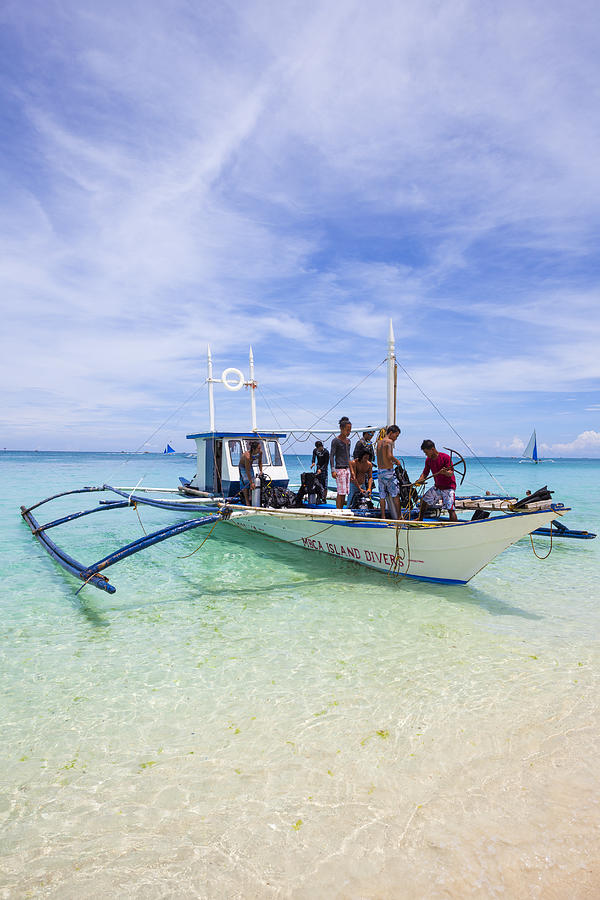 Passengers board an outrigger boat at Boracay, Philippines #1 Photograph by Holgs Passengers board an outrigger boat at Boracay, Philippines #1 Photograph by Holgs