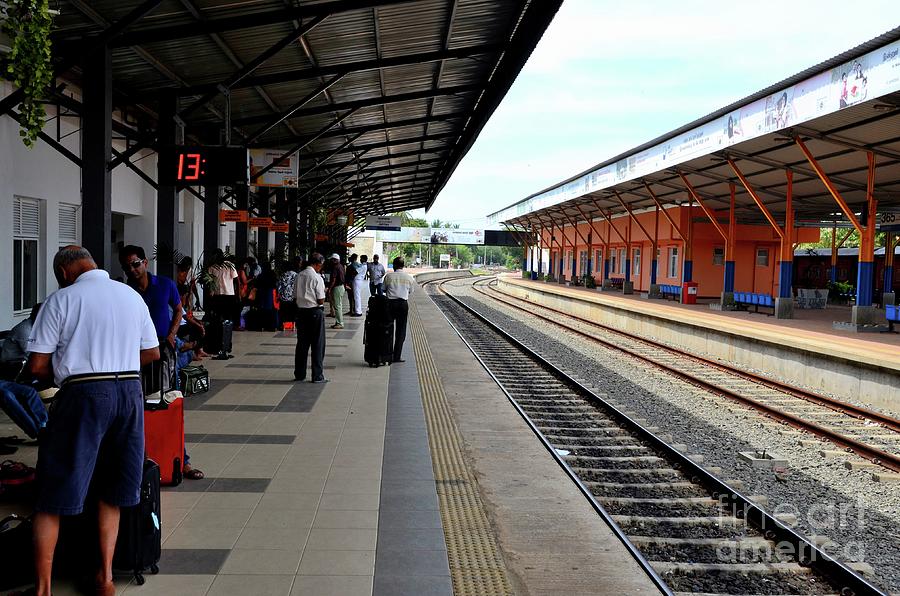 Passengers wait on platform for Colombo bound train at Jaffna Railway Station Sri Lanka #2 Photograph by Imran Ahmed
