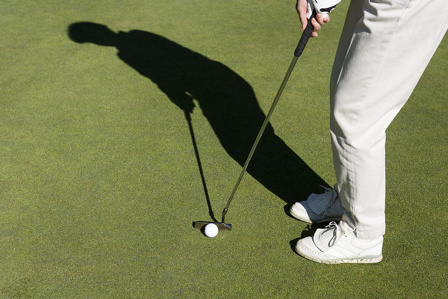 Person playing golf #1 Photograph by Comstock Images