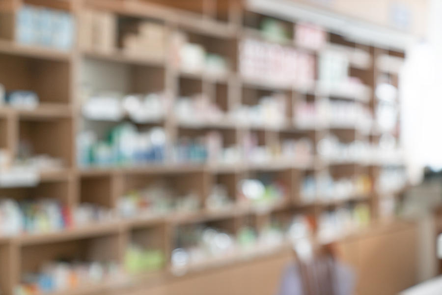 Pharmacy blurred light tone with store drugs shelves interior background, Concept of pharmacist and chemist, middle east or transcontinental region centered on western asia. #1 Photograph by Witthaya Prasongsin