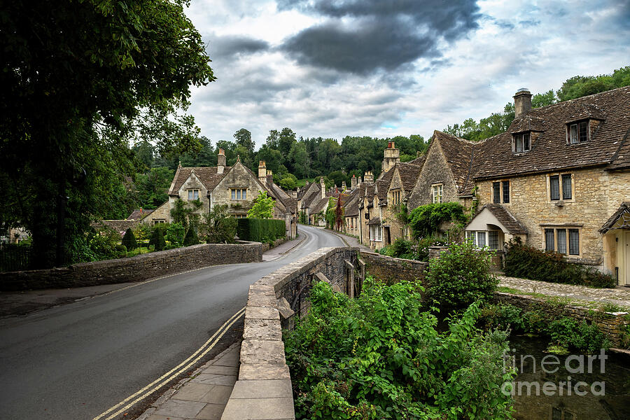 Picturesque Village Castle Combe In The Cotswolds Area In Wiltshire In England, United Kingdom #1 Photograph by Andreas Berthold