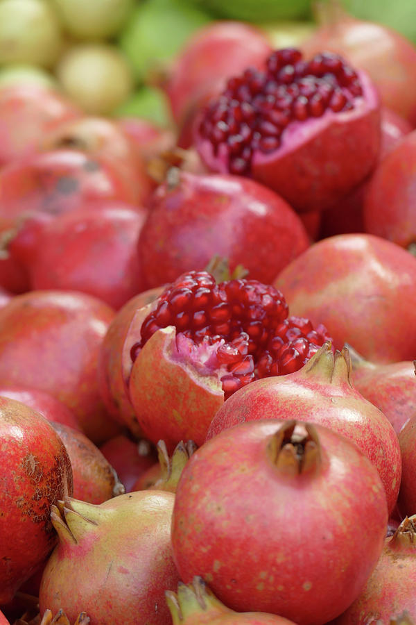 Piles of ripe pomegranates at  Udaipur market #2 Photograph by Steve Estvanik