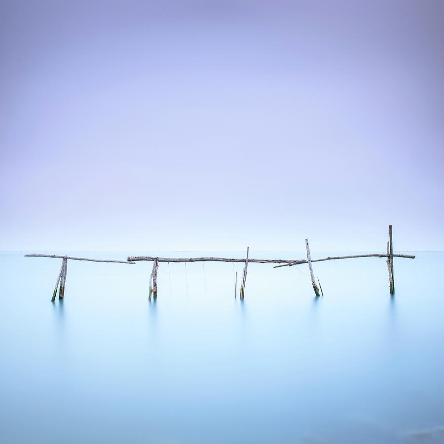 Poles and soft water on water landscape. Long exposure. #1 Photograph by Stefano Orazzini