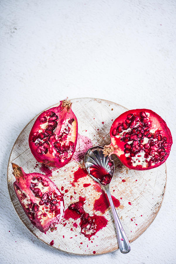 Pomegranate cut on board #1 Photograph by Merc67