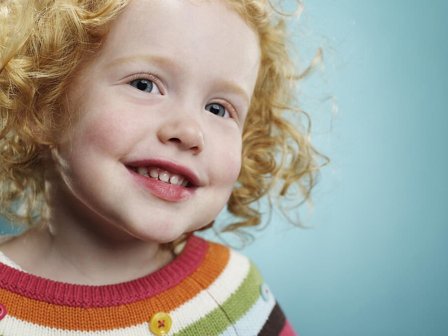 Portrait of a smiling 3 year old girl.  #1 Photograph by Ryan McVay
