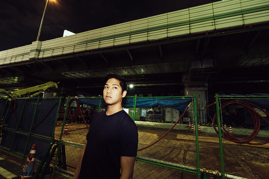 Portrait of contemporary young Japanese man at night street #1 Photograph by Masafumi Nakanishi